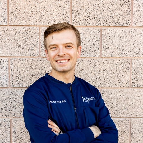 Dr. Andrew J. Cook, DMD in Scrubs